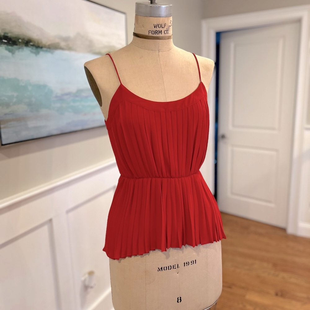 Spaghetti strap, pleated top in reddish orange, size Small.